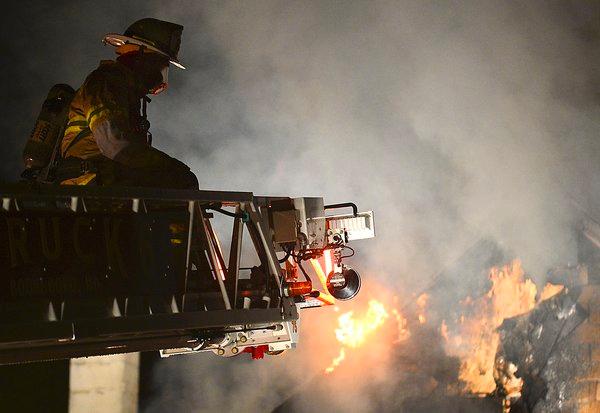 Chief 6 operates on the aerial of the Remsburg Rd. House Fire